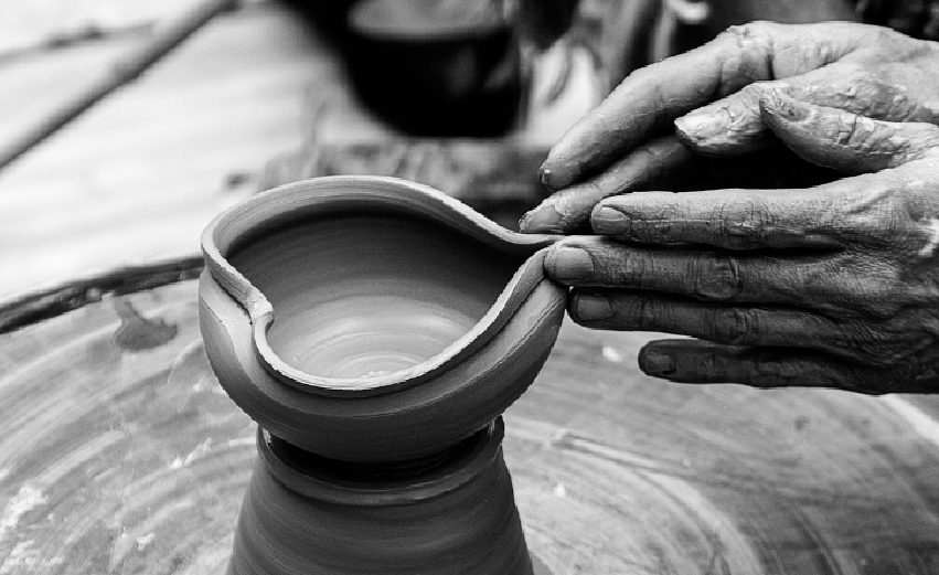 hands molding clay