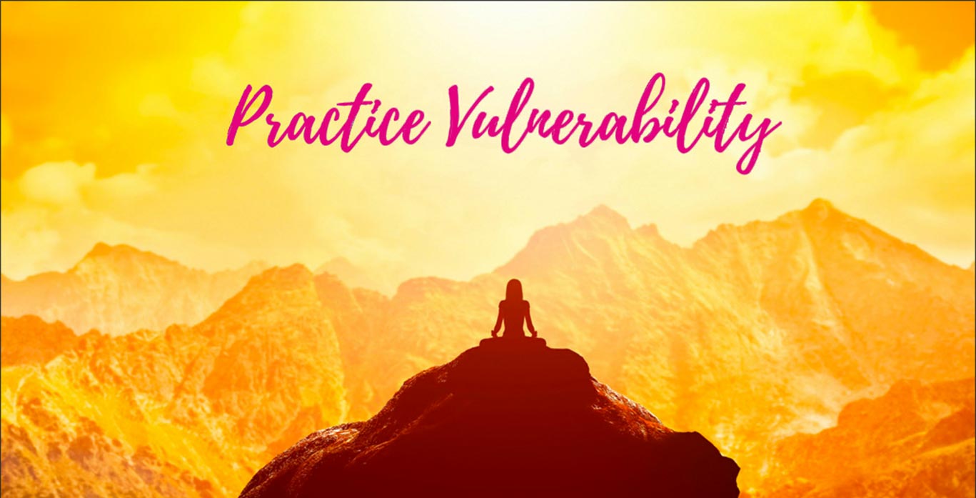 silhouette of a person on top of a hill looking at the horizon